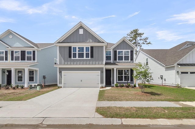 327 Hillman Trl Dr, Moncks Corner, SC 29461 - view of front of property with board and batten siding, concrete driveway, an attached garage, a front yard, and central AC