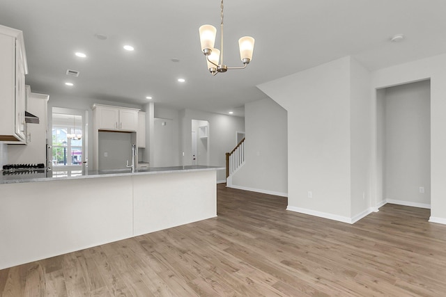 327 Hillman Trl Dr, Moncks Corner, SC 29461 - kitchen with a chandelier, light countertops, light wood finished floors, white cabinets, and recessed lighting
