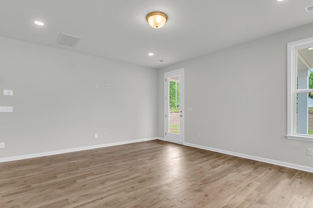 327 Hillman Trl Dr, Moncks Corner, SC 29461 - empty room featuring wood finished floors, healthy amount of natural light, baseboards, and recessed lighting