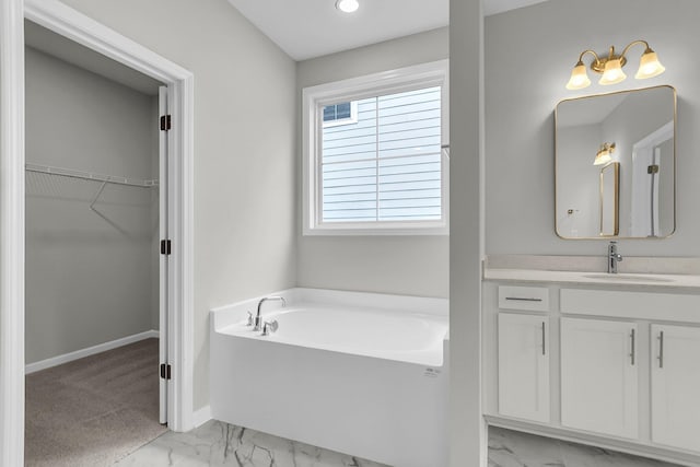 327 Hillman Trl Dr, Moncks Corner, SC 29461 - full bathroom with marble finish flooring, a bath, vanity, a walk in closet, and baseboards