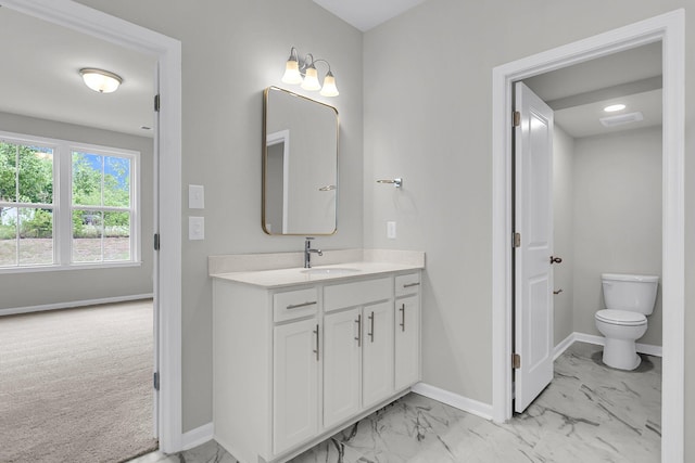 327 Hillman Trl Dr, Moncks Corner, SC 29461 - bathroom featuring marble look tiles, baseboards, vanity, and toilet
