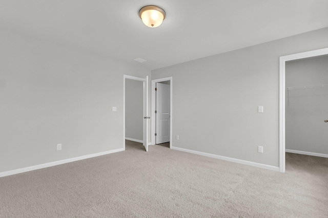 327 Hillman Trl Dr, Moncks Corner, SC 29461 - unfurnished bedroom featuring a walk in closet, carpet floors, baseboards, and a closet