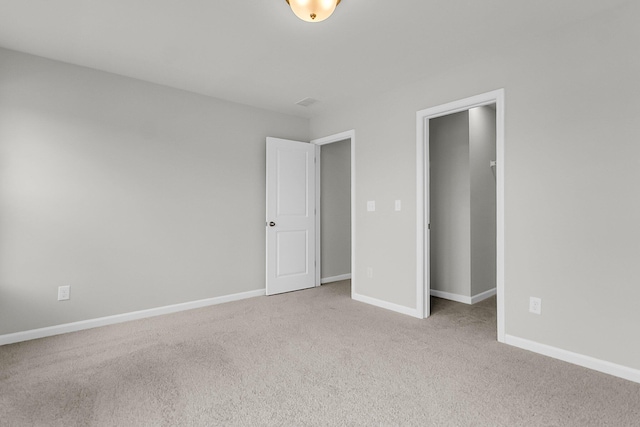 327 Hillman Trl Dr, Moncks Corner, SC 29461 - unfurnished bedroom featuring carpet flooring, a spacious closet, baseboards, and a closet