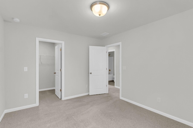 327 Hillman Trl Dr, Moncks Corner, SC 29461 - unfurnished bedroom featuring carpet floors, a walk in closet, baseboards, and a closet