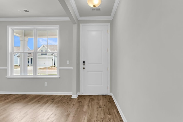 327 Hillman Trl Dr, Moncks Corner, SC 29461 - entryway featuring wood finished floors, baseboards, and crown molding