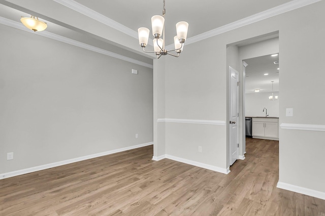 327 Hillman Trl Dr, Moncks Corner, SC 29461 - unfurnished room featuring light wood-style floors, a chandelier, baseboards, crown molding, and a sink