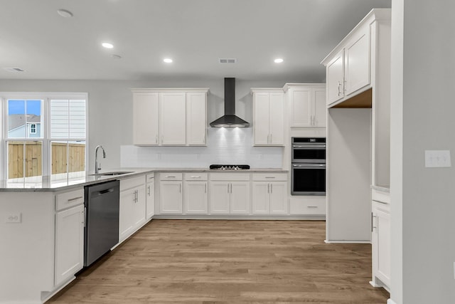 327 Hillman Trl Dr, Moncks Corner, SC 29461 - kitchen with wall chimney exhaust hood, appliances with stainless steel finishes, a sink, a peninsula, and white cabinetry