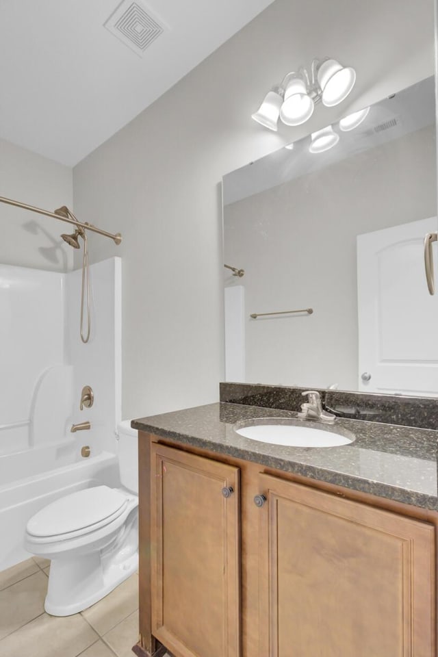 full bathroom with tile patterned flooring, vanity,  shower combination, and toilet