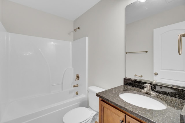 full bathroom with bathtub / shower combination, vanity, and toilet