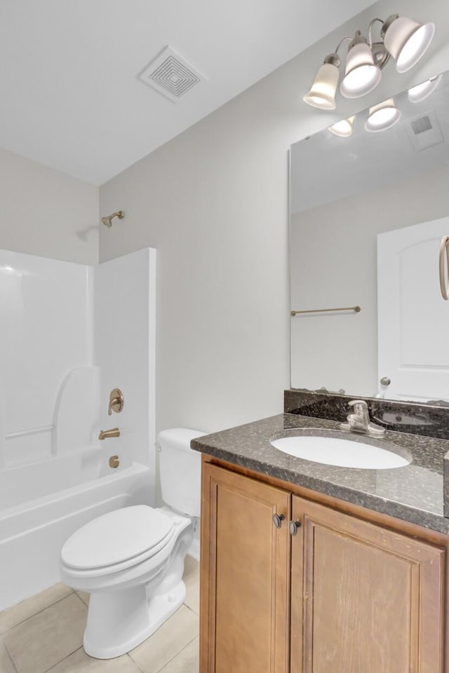 full bathroom featuring tile patterned flooring, vanity, toilet, and shower / washtub combination