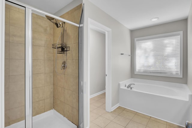 bathroom with tile patterned flooring and plus walk in shower