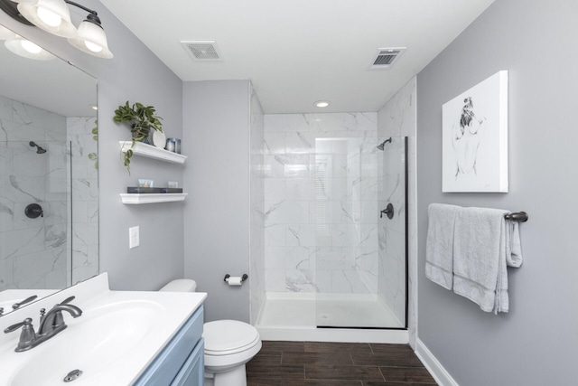 full bathroom with toilet, a marble finish shower, and visible vents