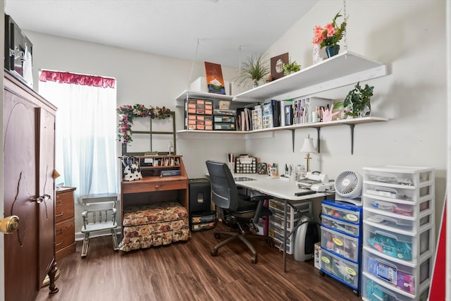 home office featuring built in study area and wood finished floors