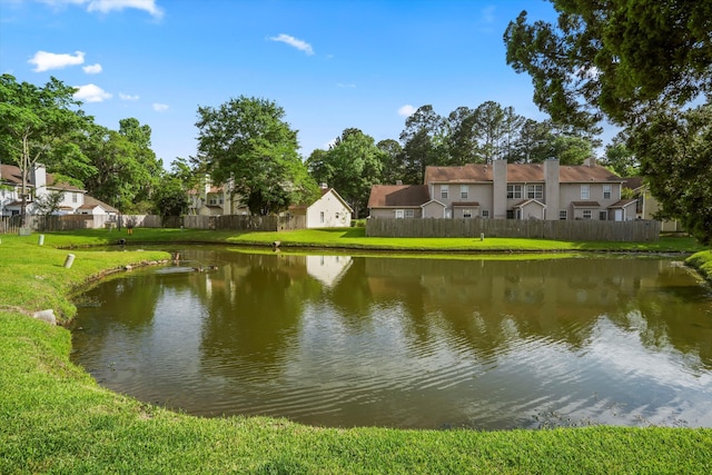 water view featuring fence and a residential view