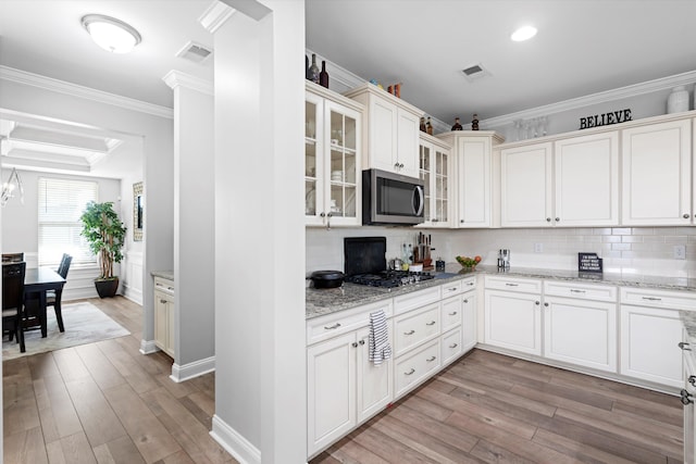 451 Spectrum Rd, Summerville, SC 29486 - kitchen featuring appliances with stainless steel finishes, crown molding, light wood finished floors, tasteful backsplash, and recessed lighting
