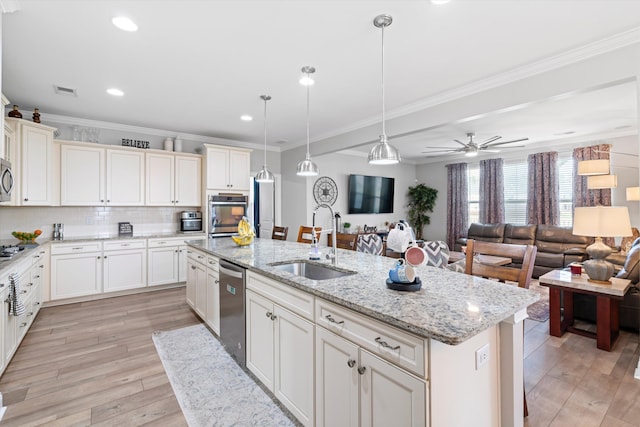 451 Spectrum Rd, Summerville, SC 29486 - kitchen with a sink, appliances with stainless steel finishes, a kitchen island with sink, open floor plan, and light wood finished floors