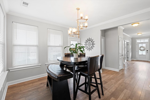 451 Spectrum Rd, Summerville, SC 29486 - dining space featuring a chandelier, light wood finished floors, baseboards, and ornamental molding