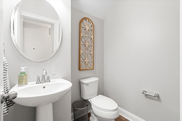 451 Spectrum Rd, Summerville, SC 29486 - bathroom featuring toilet, baseboards, and a sink