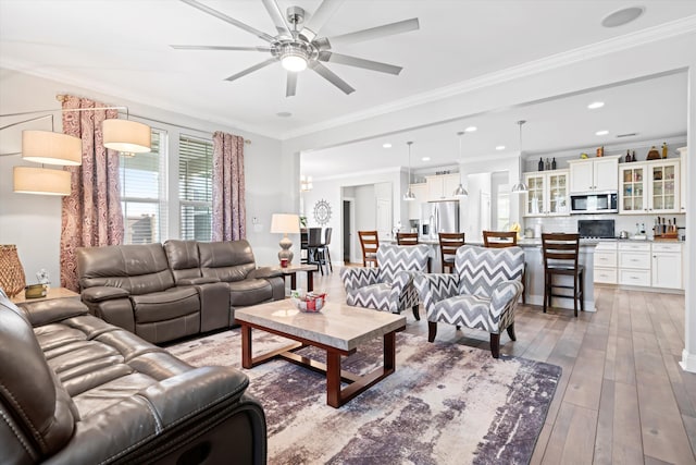 451 Spectrum Rd, Summerville, SC 29486 - living area with ceiling fan, ornamental molding, light wood-style flooring, and recessed lighting
