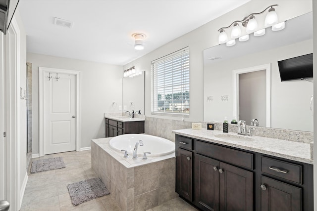 451 Spectrum Rd, Summerville, SC 29486 - bathroom with a bath, two vanities, and tile patterned flooring