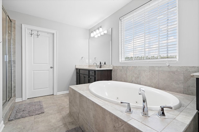 451 Spectrum Rd, Summerville, SC 29486 - full bath with vanity, a tub with jets, a stall shower, tile patterned flooring, and baseboards