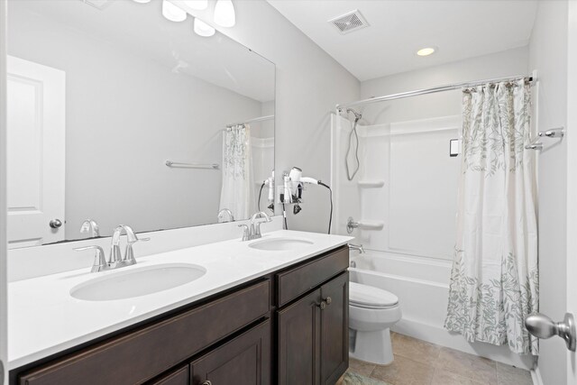 451 Spectrum Rd, Summerville, SC 29486 - full bathroom featuring shower / bath combo, toilet, double vanity, tile patterned floors, and recessed lighting