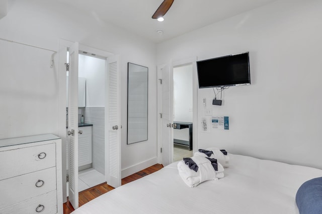 bedroom featuring hardwood / wood-style flooring and ceiling fan