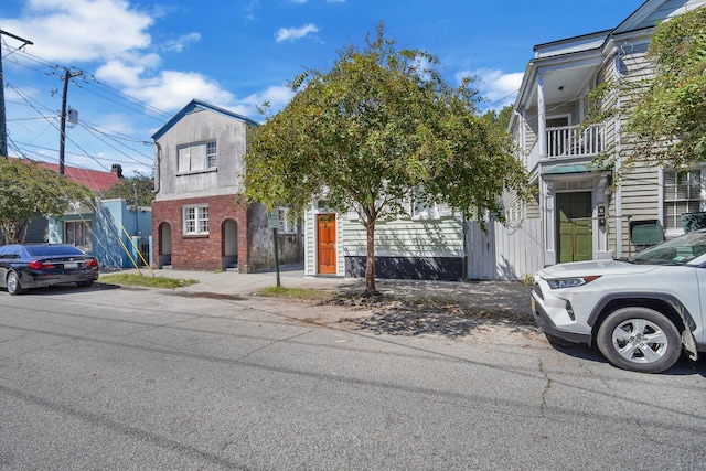 view of front of home with a balcony