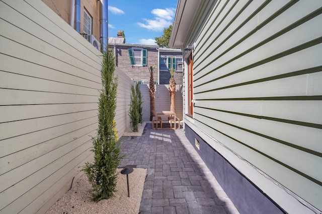 view of side of property with a patio area