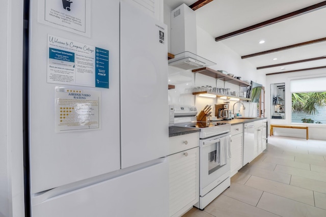 kitchen with sink, white appliances, beam ceiling, extractor fan, and white cabinets