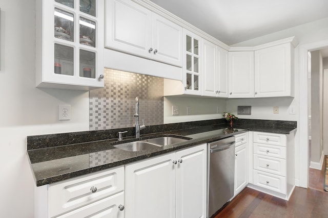 kitchen with glass insert cabinets, white cabinetry, a sink, and stainless steel dishwasher