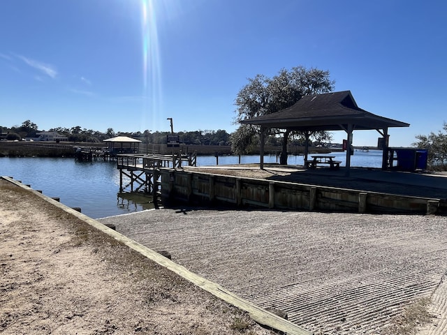 view of dock featuring a water view and a gazebo