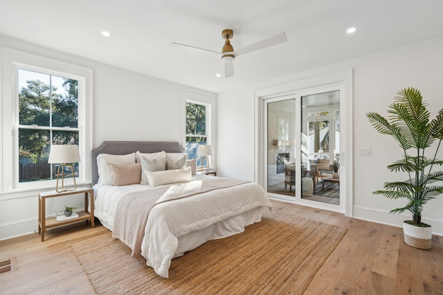 bedroom featuring ceiling fan, access to exterior, and light hardwood / wood-style flooring