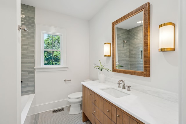 full bathroom with tile patterned flooring, vanity, toilet, and tiled shower / bath