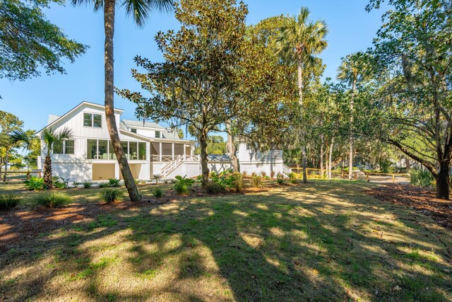 view of yard with a sunroom