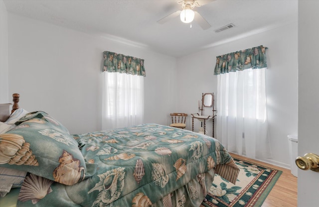 bedroom with hardwood / wood-style flooring and ceiling fan