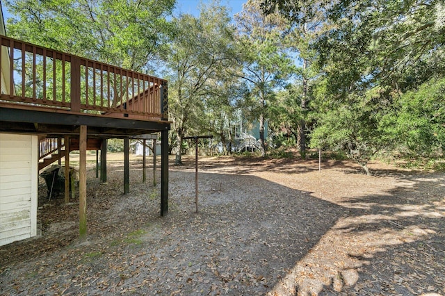 view of yard with a wooden deck