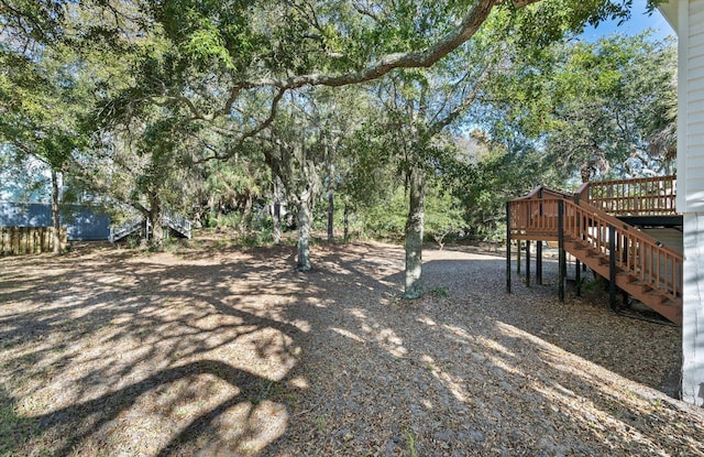 view of yard featuring a wooden deck