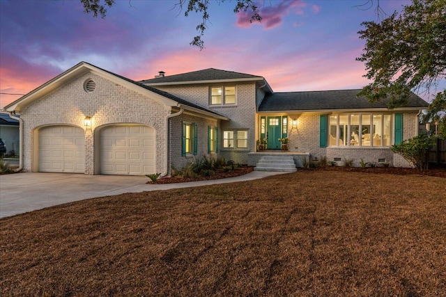 1894 Capri Dr, Charleston, SC 29407 - split level home featuring an attached garage, brick siding, driveway, a yard, and crawl space
