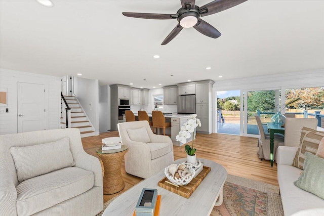 1894 Capri Dr, Charleston, SC 29407 - living room with light wood finished floors, stairway, ceiling fan, and recessed lighting