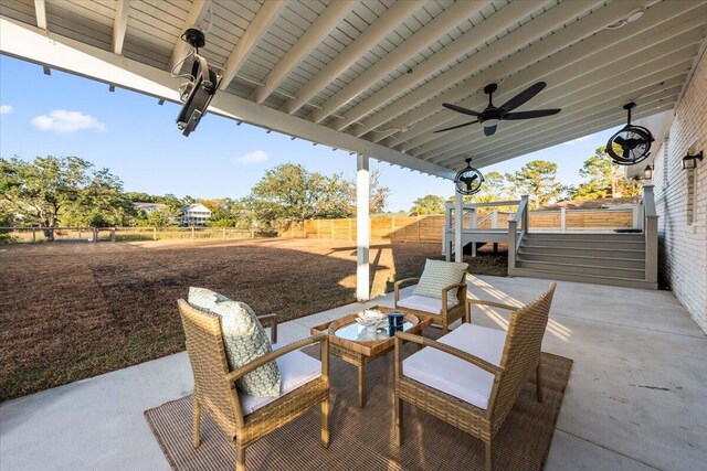 1894 Capri Dr, Charleston, SC 29407 - fenced backyard with a ceiling fan and a patio area