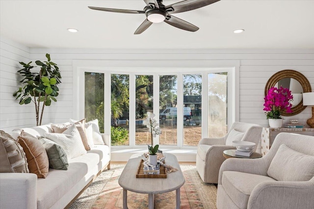 1894 Capri Dr, Charleston, SC 29407 - living room featuring a ceiling fan, recessed lighting, wood walls, and light wood-type flooring