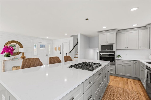 1894 Capri Dr, Charleston, SC 29407 - kitchen featuring stainless steel appliances, gray cabinetry, light countertops, light wood-type flooring, and recessed lighting