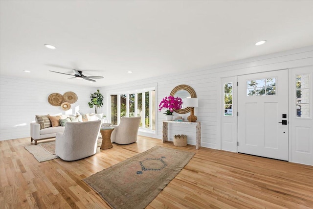 entryway featuring light wood-type flooring and ceiling fan