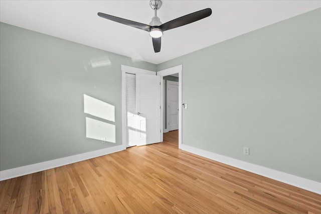 unfurnished room featuring light wood-type flooring and ceiling fan