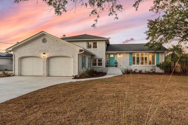 1894 Capri Dr, Charleston, SC 29407 - split level home featuring brick siding, a garage, concrete driveway, and crawl space