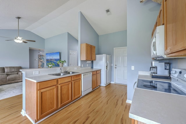 kitchen with white appliances, a ceiling fan, visible vents, a sink, and open floor plan