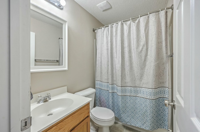 bathroom with toilet, a shower with shower curtain, vanity, tile patterned floors, and a textured ceiling