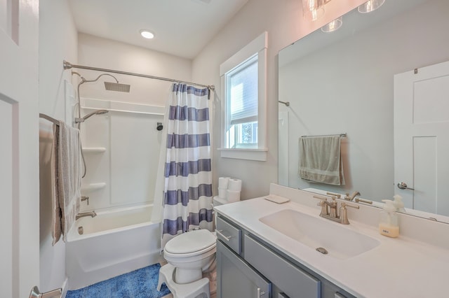 full bathroom with toilet, vanity, and shower / bath combo with shower curtain