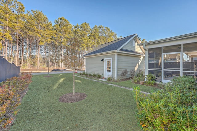 view of yard with a sunroom